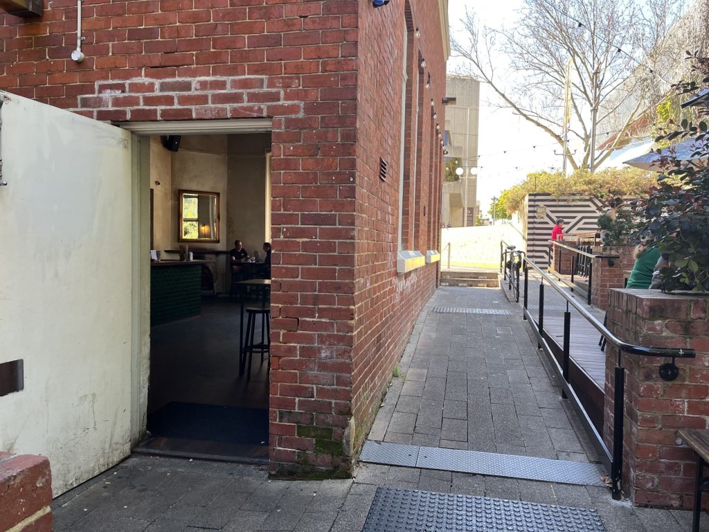 PICA Bar accessible entrance with ramp to the right