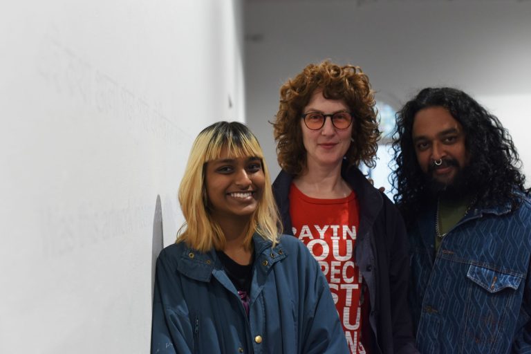Paean Sarkar, Hannah Mathews and Ramesh Nithiyendran in front of Hatched 2023 Dr Harold Schenberg Art Fellowship recipient Paean Sarkar's এই শিল্পকর্মটি কি incomplete? (detail), 2022, Hatched: National Graduate Show 2023, installation view, Perth Institute of Contemporary Arts, 2023, photo: Dan McCabe